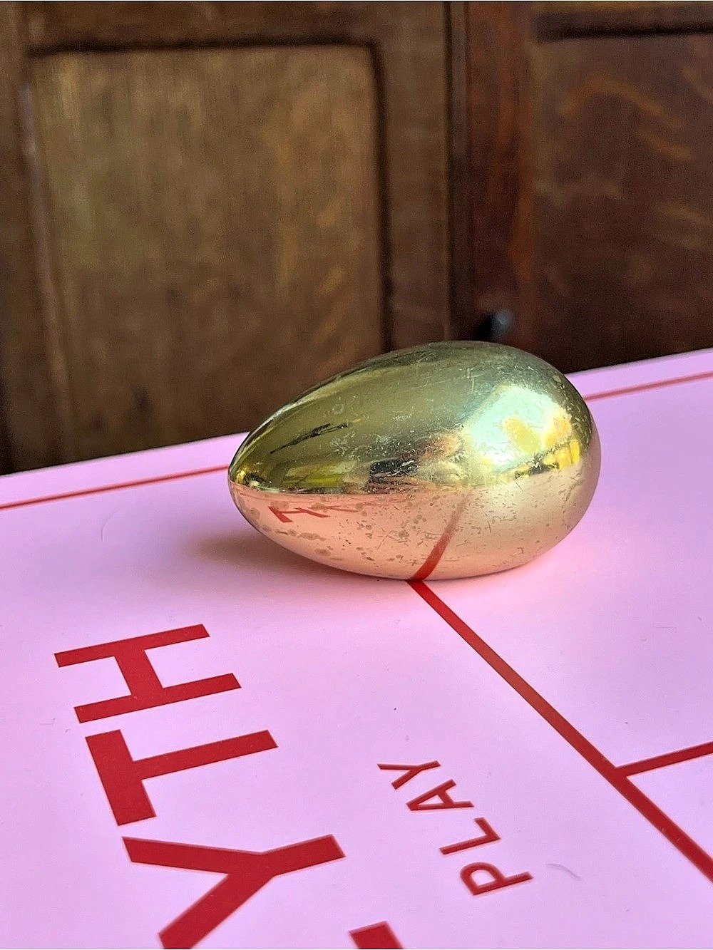 Vintage brass egg paper weight